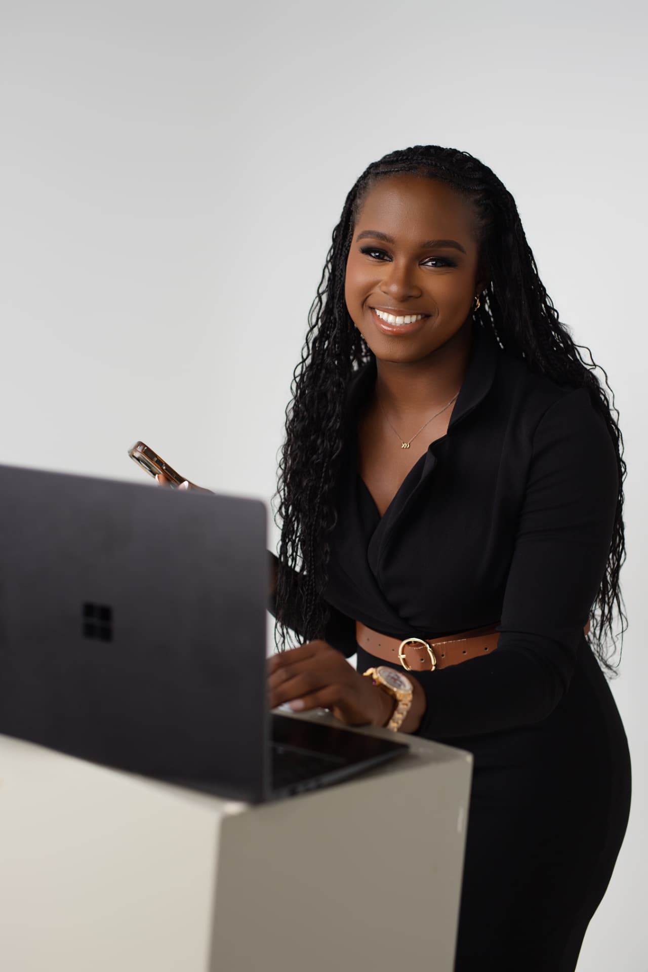 Daniella Jasper-Okumagba smiling at her desk